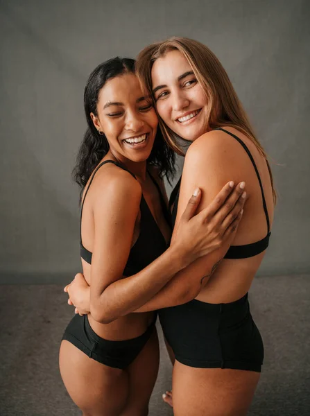 Two Happy Smiling Female Girlfriends Standing Studio Embracing Underwear High — Φωτογραφία Αρχείου