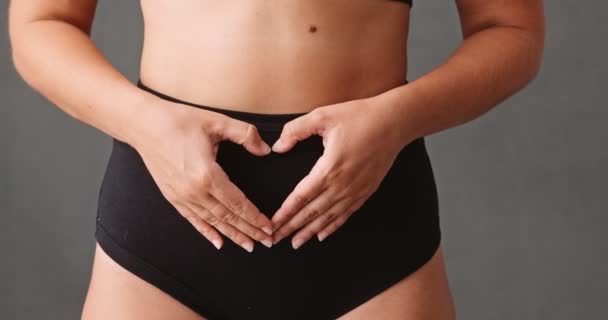 Young Caucasian Female Making Heart Shaped Her Hands Her Abdomen — Stock video