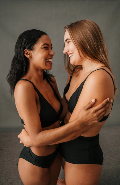 Two Very Happy Smiling Girlfriends Studio Embracing Underwear High Quality — Φωτογραφία Αρχείου