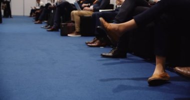Audience sitting in conference center listening to speech. taking notes on there laptops High quality 4k footage