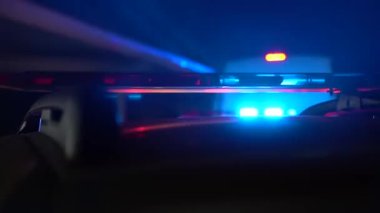 Red blue warning lights on a police car. Slow motion