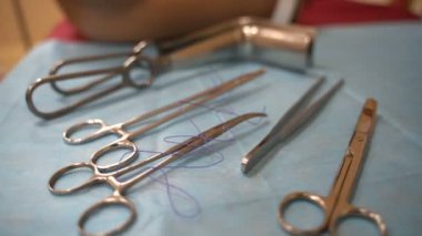 Training for surgeon students on mannequins. Medical instruments are on the table