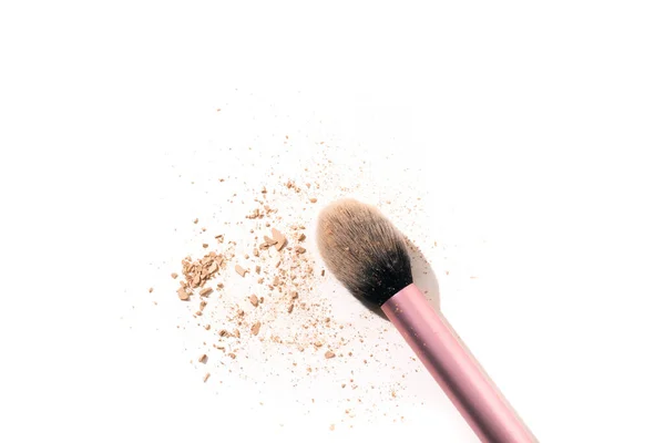 Traces of powder with a makeup brush, isolated on the white background. Copy space. — Stock Photo, Image