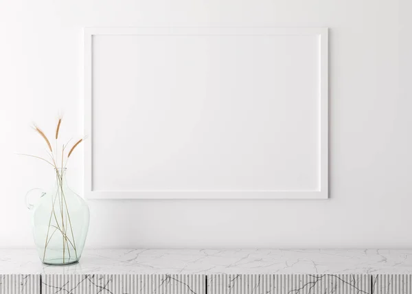 Empty picture frame on white wall in modern living room. Mock up interior in minimalist, scandinavian style. Free space for your picture. Marble console and dried grass in glass vase. 3D rendering.