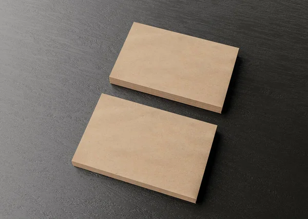 Blank brown cardboard business cards on dark wooden table. Mockup for branding identity. Two stacks, to show both sides of card. Template for graphic designers. Feee space, copy space. — Foto de Stock