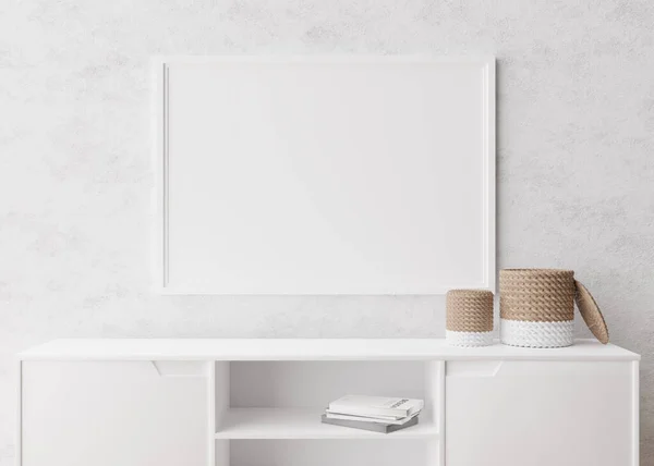 Empty horizontal picture frame on white wall in modern living room. Mock up interior in minimalist, scandinavian style. Free, copy space for picture. Console, rattan basket. 3D rendering.