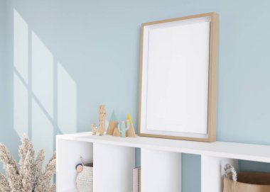 Modern çocuk odasında büfenin üzerinde duran boş dikey resim çerçevesi. Çerçeve çağdaş tarzda modellenir. Bedava, fotoğraf için fotokopi alanı, poster. Oyuncaklar, otlar. Manzarayı kapat. 3B görüntüleme