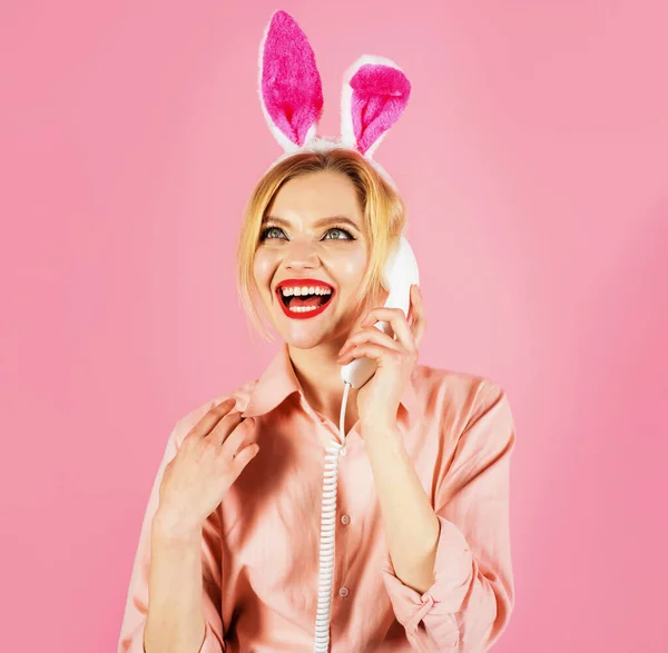 Smiling woman in bunny ears talking on phone. Easter greetings. Communication. Rabbit girl. — Stock Photo, Image