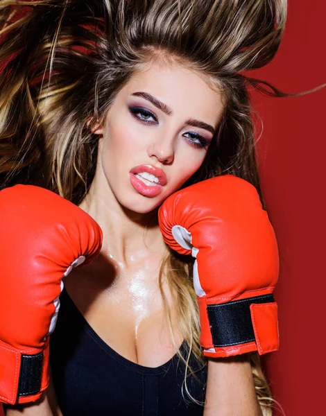 Athlete boxer woman in boxing gloves. Sporty sexy girl. Sport exercise, fitness workout.