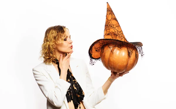 Sensual woman with pumpkin. Happy halloween. Trick or treat. Blond girl with Jack-o-lantern. Autumn