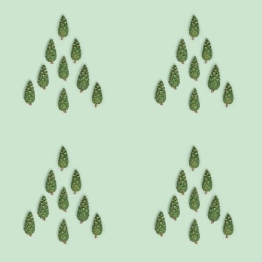 Doğal yeşil kozalaklı kusursuz desenler pastel yeşil kağıttaki noel ağacı gibi. Noel ve Yeni Yıl Tatil Doğa Tarihi. Doğal çevre süsü.