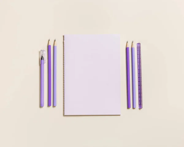 Frame with school stationery violet color. Back to school concept, notebook, note, pen, paper clips on pastel beige background. Office equipment with copy space, geometric flat lay, top view — Stock Photo, Image
