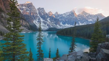 Scenic sunset or sunrise view of Moraine Lake landscape, a popular tourist destination in Banff National Park, Alberta, Canada in the Rocky Mountains.