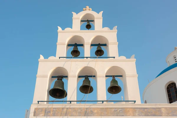 The traditional Greek Orthodox church bells at the Church of Panagia Akathistos Hymn in the old town of Oia on the Greek Island of Santorini, Greece.