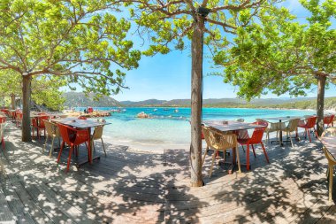 Fabulous view of  Santa Giulia resort from beach bar. Famous travel destination. Location: Santa Giulia, Porto-Vecchio, Corsica, France, Europe