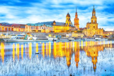 Sunset on Elbe river with panorama of Cathedral of the Holy Trinity or Hofkirche, Bruehl's Terrace or The Balcony of Europe Location: Dresden, state of Saxony, Germany, Europe