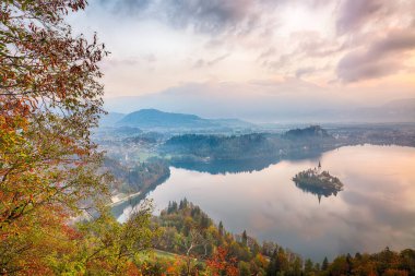 Amazing sunrise over popular tourist destination  Bled lake. Dramatic view of Pilgrimage Church of the Assumption of Maria. Location: Bled, Upper Carniolan region, Slovenia, Europe