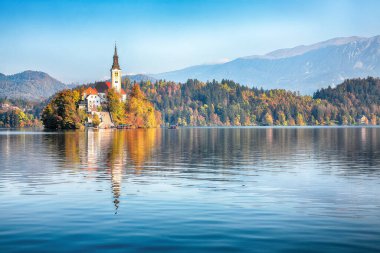 Splendid  sunny day view of popular tourist destination  Bled lake. Dramatic view of Pilgrimage Church of the Assumption of Maria. Location: Bled, Upper Carniolan region, Slovenia, Europe