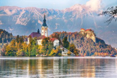 Astonishing sunset view of popular tourist destination  Bled lake. Dramatic view of Pilgrimage Church of the Assumption of Maria. Location: Bled, Upper Carniolan region, Slovenia, Europe
