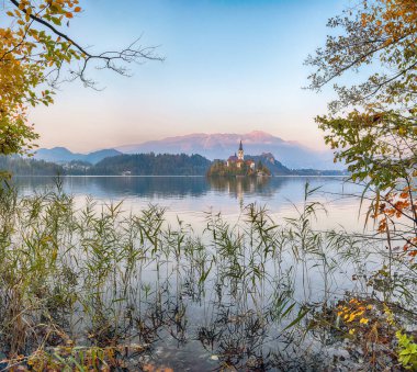 Amazing sunset over popular tourist destination  Bled lake. Dramatic view of Pilgrimage Church of the Assumption of Maria. Location: Bled, Upper Carniolan region, Slovenia, Europe