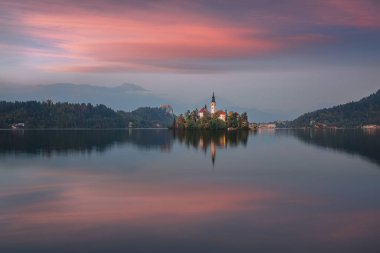 Stunning sunset view of popular tourist destination  Bled lake. Dramatic view of Pilgrimage Church of the Assumption of Maria. Location: Bled, Upper Carniolan region, Slovenia, Europe