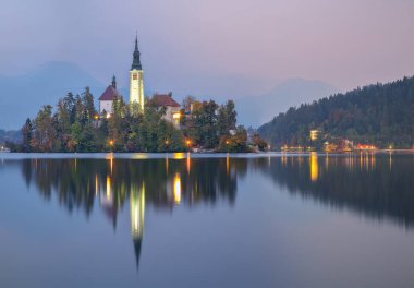 Astonishing sunset view of popular tourist destination  Bled lake. Dramatic view of Pilgrimage Church of the Assumption of Maria. Location: Bled, Upper Carniolan region, Slovenia, Europe