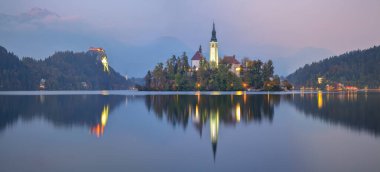 Astonishing sunset view of popular tourist destination  Bled lake. Dramatic view of Pilgrimage Church of the Assumption of Maria. Location: Bled, Upper Carniolan region, Slovenia, Europe