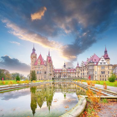 Astonishing autumn landscape with Moszna Castle. Popular tourist destination. Location: Moszna, Opolskie Voivodeship, Poland, Europe
