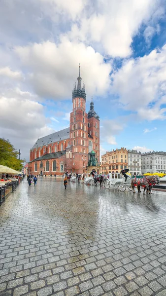 Amazing cityscape of Krakow with St. Mary's Basilica on Main Square. Popular tourist destination. Location: Krakow, Lesser Poland Voivodeship, Poland, Europe