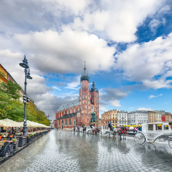 Astonishing cityscape of Krakow with St. Mary's Basilica on Main Square. Popular tourist destination. Location: Krakow, Lesser Poland Voivodeship, Poland, Europe