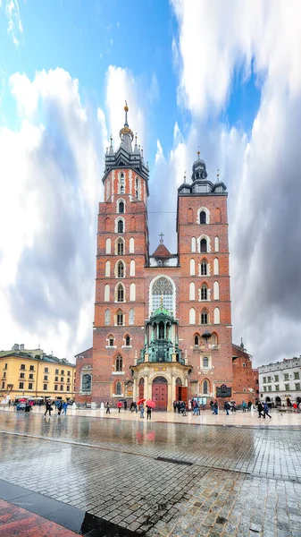 Astonishing cityscape of Krakow with St. Mary's Basilica on Main Square. Popular tourist destination. Location: Krakow, Lesser Poland Voivodeship, Poland, Europe