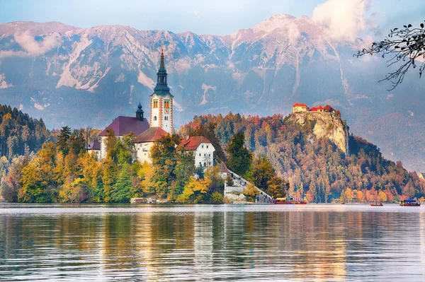 Astonishing sunset view of popular tourist destination  Bled lake. Dramatic view of Pilgrimage Church of the Assumption of Maria. Location: Bled, Upper Carniolan region, Slovenia, Europe