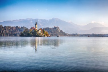 Gorgeous sunny day view of popular tourist destination  Bled lake. Dramatic view of Pilgrimage Church of the Assumption of Maria. Location: Bled, Upper Carniolan region, Slovenia, Europe