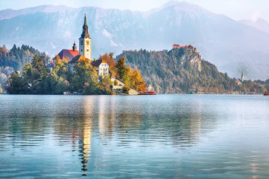 Fabulous sunny day view of popular tourist destination  Bled lake. Dramatic view of Pilgrimage Church of the Assumption of Maria. Location: Bled, Upper Carniolan region, Slovenia, Europe
