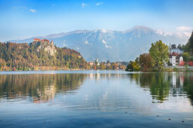 Gorgeous sunny day view of popular tourist destination  Bled lake. Dramatic view of Bled castle with mountain range. Location: Bled, Upper Carniolan region, Slovenia, Europe