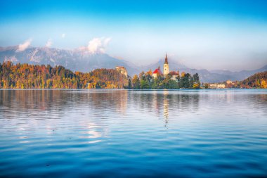 Gorgeous sunny day view of popular tourist destination  Bled lake. Dramatic view of Pilgrimage Church of the Assumption of Maria. Location: Bled, Upper Carniolan region, Slovenia, Europe