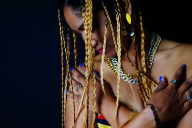 Braided hair woman with arms crossed