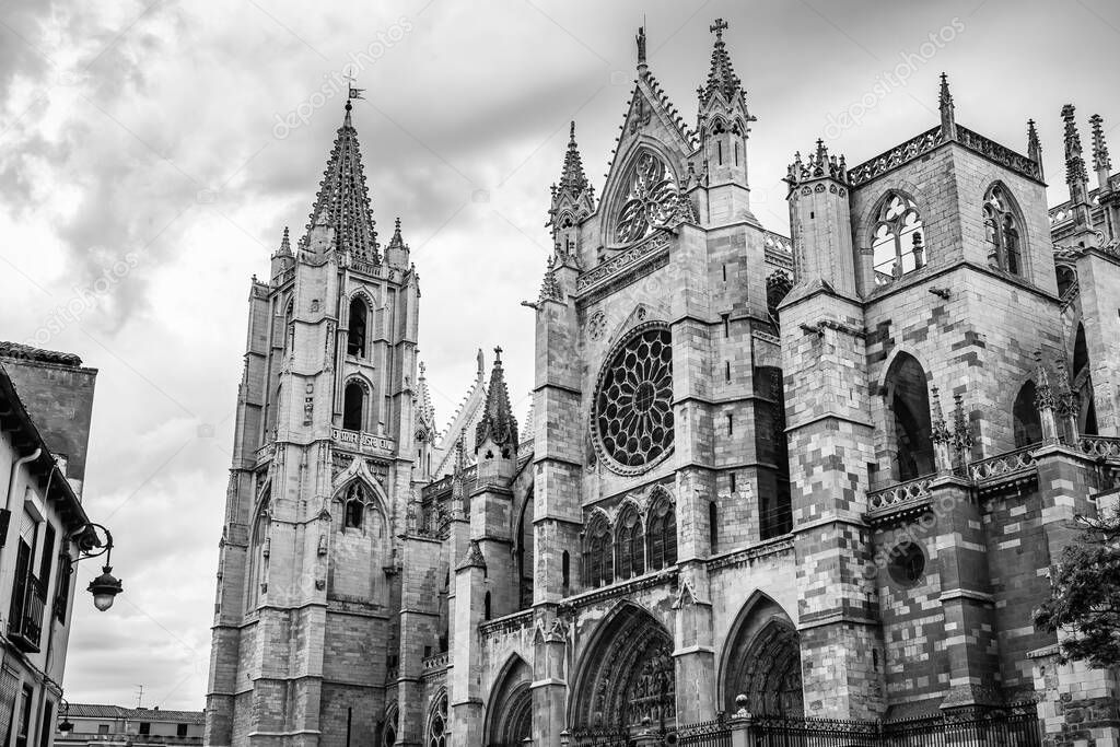 Gothic Cathedral of the city of Leon in Spain, in black and white and dramatic sky
