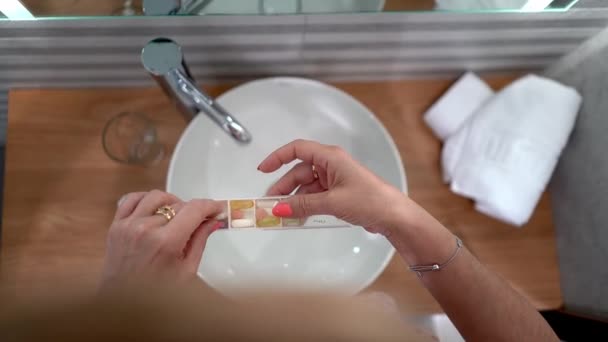 Woman Placing Pillbox All Medicines She Takes Every Day — Stock Video