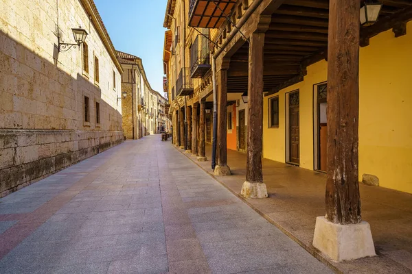 Arcades of old buildings fastened with very old wooden columns in the Burgo de Osma, Castilla Leon