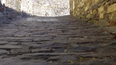 Narrow street in town with old houses and mountain views. Patones de Arriba Madrid