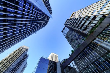 Steel and glass skyscraper buildings in Madrids financial district on a sunny day, Spain