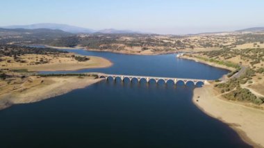 Aerial view of a drone over a blue lake with water scarcity due to drought and lack of rain, Salamanca, Spain.