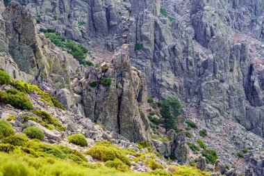 Rock wall with whimsical shapes in the high mountain of the Community of Madrid, Guadarrama, Spain