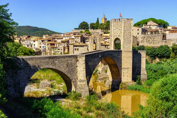 Stone bridge over the river at the entrance of the medieval town of Besalu, in Girona, Catalonia