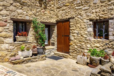 Facade of a typical house made of stone in the mountains of Catalonia, Beget, Girona