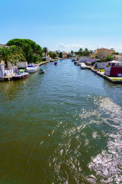 Water channel through which the boats circulate as if they were streets in the coastal urbanization of Ampuriabrava, Girona, Catalonia