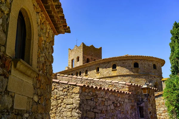 Old church and medieval stone houses in the tourist town of Pals, Girona, Spain