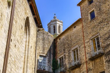 Old stone houses and cathedral tower emerging above the roofs, Gerona, Spain