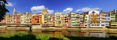 Panoramic view of the picturesque colorful houses next to the Onyar River as it passes through the old city of Girona, Catalonia, Spain